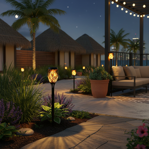 Evening outdoor setting with huts, garden lights, and a couch under string lights.