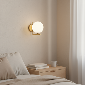 Wall-mounted lamp in a bedroom setting with a bed and nightstand.