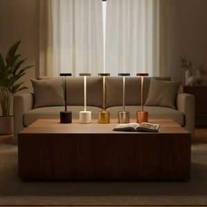 Modern living room with a coffee table featuring decorative lamps and an open book.