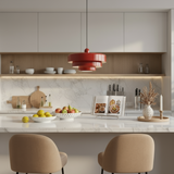 Modern kitchen with white cabinetry, marble countertop, and decorative elements.