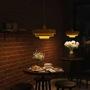 Dimly lit restaurant setting with brick wall, table with food, and hanging lights.