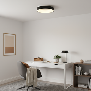 Modern home office with a white desk, chair, and ceiling light.
