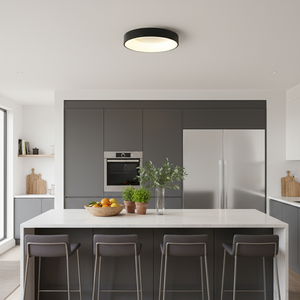 Modern kitchen with a white island, gray cabinets, and a ceiling light fixture.