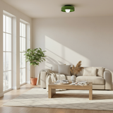 Modern living room with a beige sofa, wooden coffee table, and large windows.