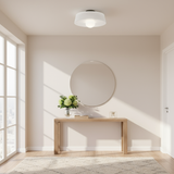Modern interior with a round mirror and wooden console table.