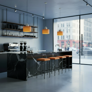 Modern kitchen with marble island, orange pendant lights, and cityscape view.