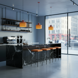 Modern kitchen with marble island and orange pendant lights