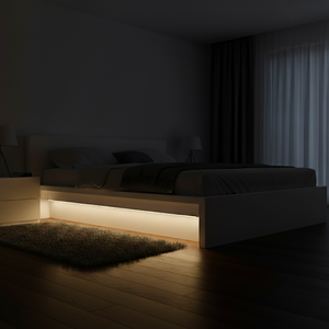 Modern bed with LED lighting in a dimly lit room