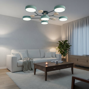 Modern living room with a chandelier, sofa, coffee table, and decorative items.