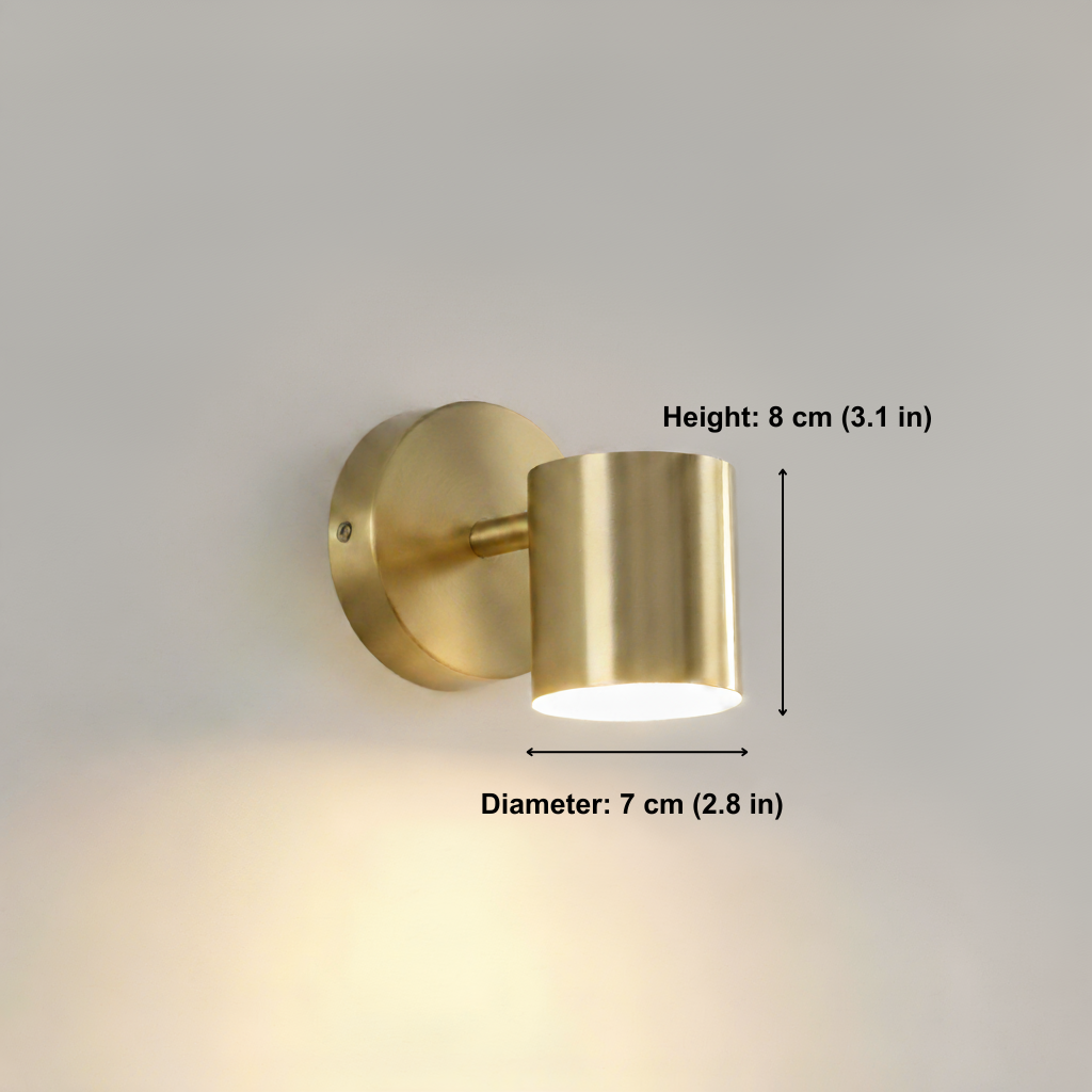 Gold wall light fixture with measurements on a gray background