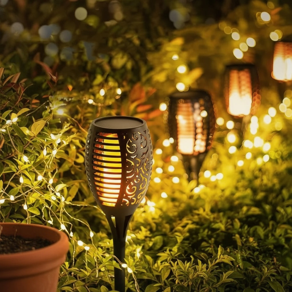 Solar-powered garden light with string lights in a garden setting